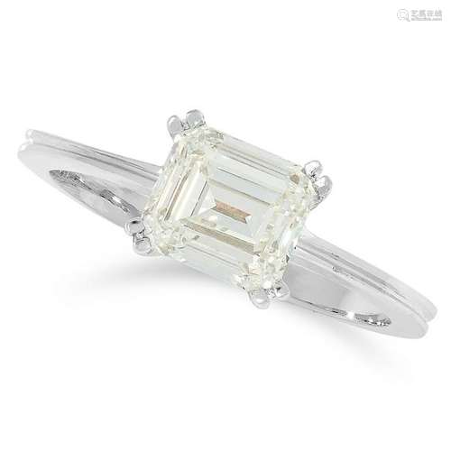 A SOLITAIRE DIAMOND RING set with an emerald cut