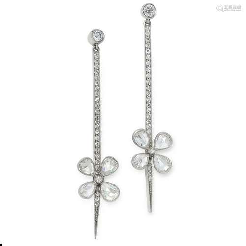 A PAIR OF DIAMOND EARRINGS each set with a line of