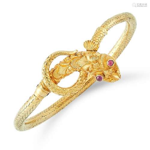 AN ANTIQUE GARNET DRAGON BANGLE depicting a dragon