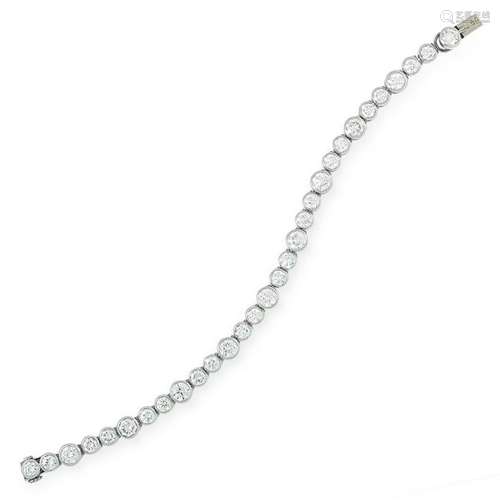 A DIAMOND TENNIS BRACELET, CARTIER set with round cut