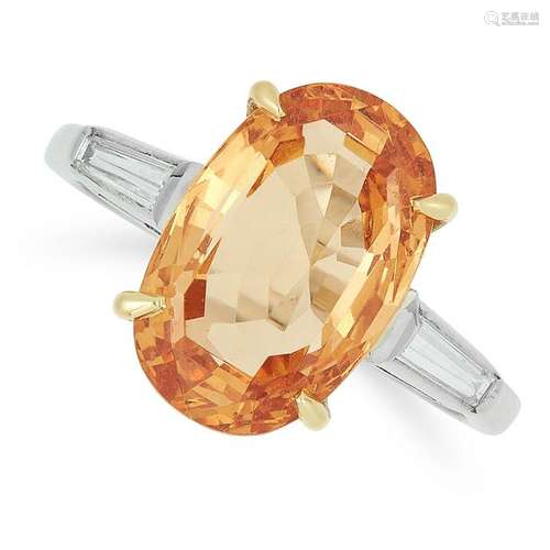 AN IMPERIAL TOPAZ AND DIAMOND RING set with an oval cut