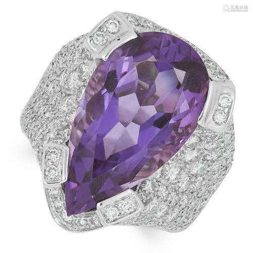 AN AMETHYST AND DIAMOND DRESS RING set with a pear cut