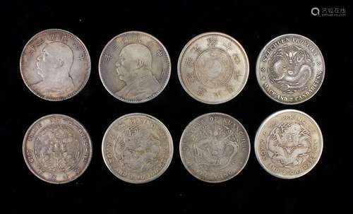 EIGHT CHINESE SILVER DOLLARS