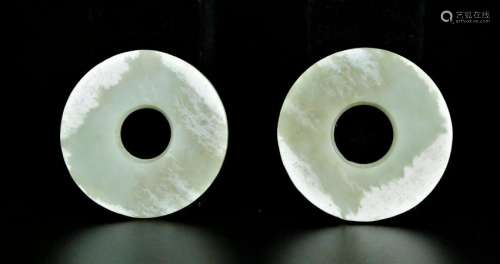 A pair of white jade disc