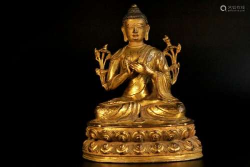 A gilt-bronze figure of sakyamuni buddha