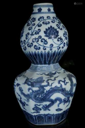 A blue and white 'phoenix' vase in the shape of a gourd