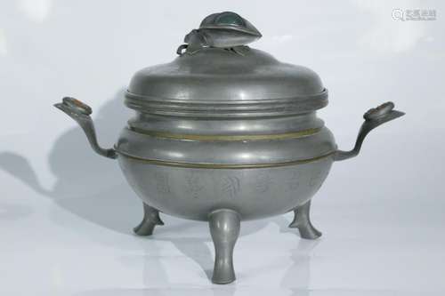 A tin warm wine utensil