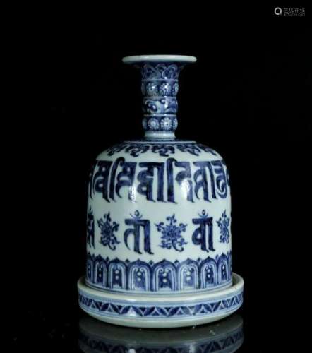 A blue and white box in shape of bell