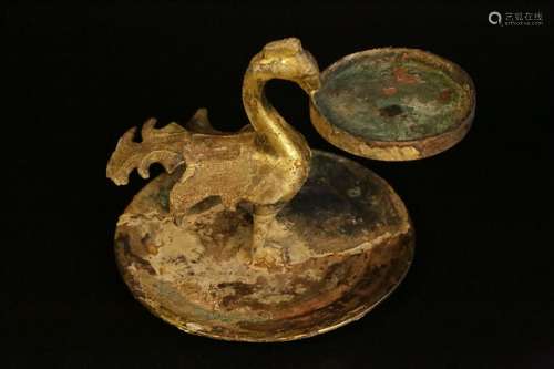 A gilt-bronze 'bird' candlestick