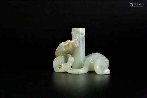 A white jade 'chi-dragon'candlestick