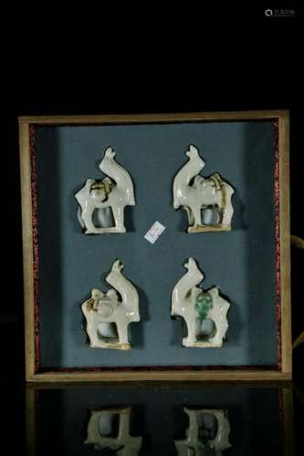 Four tri-color glazed camels