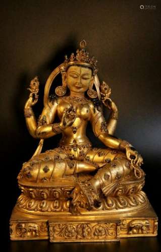 A gilt-bronze figure of manjushri