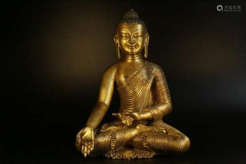 A gilt-bronze figure of buddha