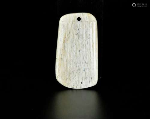 A chikeb bone white jade pendant in shape of axe