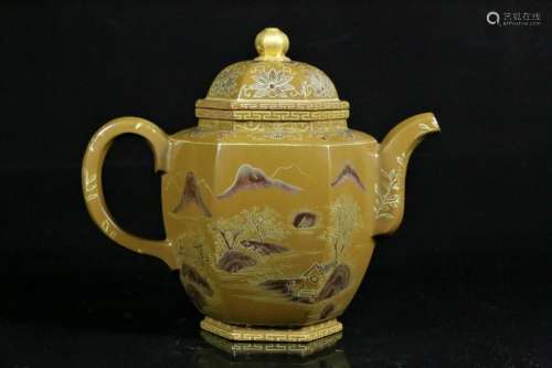 A painted enameled pottery teapot