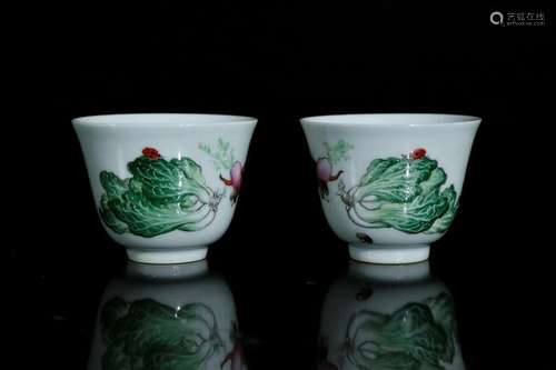 A pair of enamel painted cups