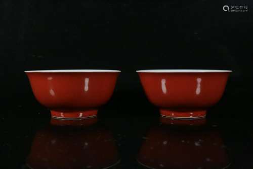 A pair of red-glazed bowls