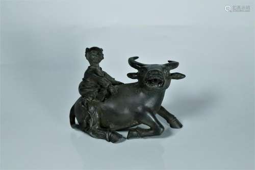 A bronze carved 'boy cattle herding'