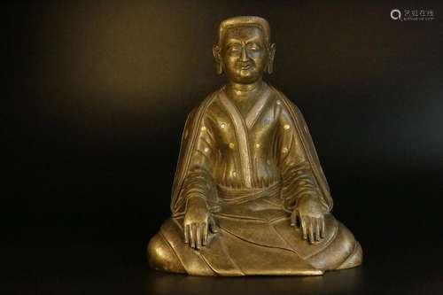 A stamp gold and silver bronze figure of guru