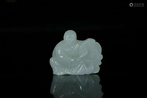 A white jade carved 'boy play drum'