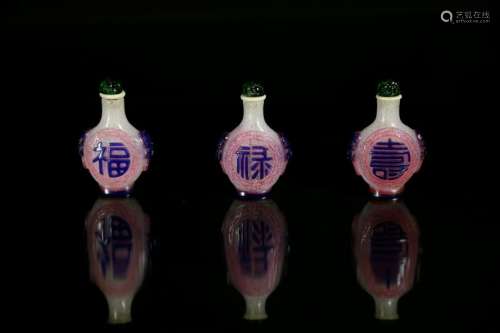 A white overlay pink glass 'fu lu shou'snuff bottle