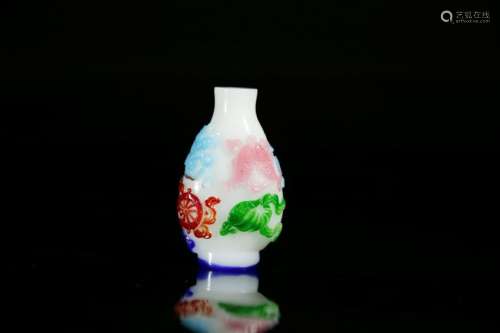 A carved four-color overlay glass overlay snuff bottle