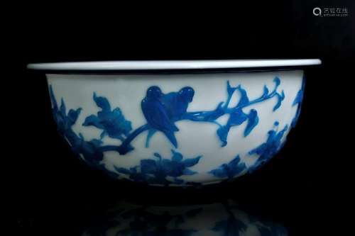 A blue overlay white glass 'bird and flowers' bowl