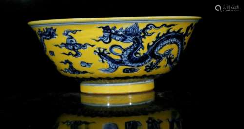 A yellow glaze with blue and white 'dragon' bowl