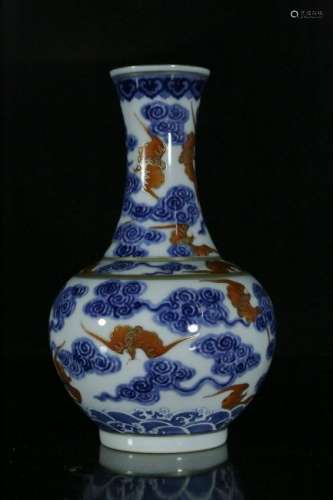 A blue and white and red vase