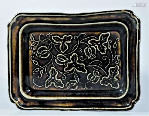 A black glaze dish