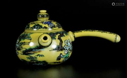 A yellow glaze teapot