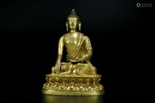 A gilt-bronze figure of buddha shakyamni