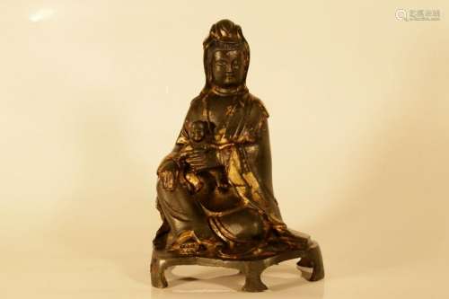 A gilt-bronze figure of GuanYin