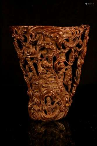 A carved eaglewood 'nine-dragon' libation cup