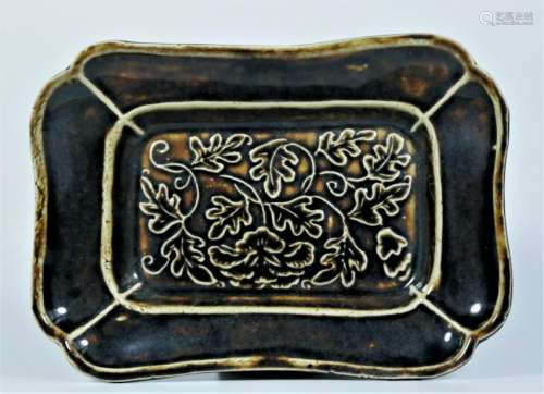 A black glaze dish