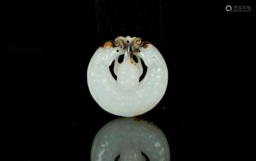 A white jade rounded pendant
