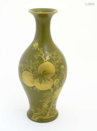 A Chinese tea dust glaze vase with gilt fruit, bat and
