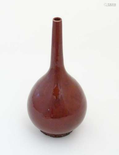 A Chinese pear-shaped vase with a slender, elongated