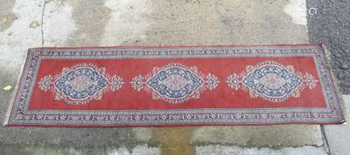 Carpet / Rug: a hand made woollen runner with red