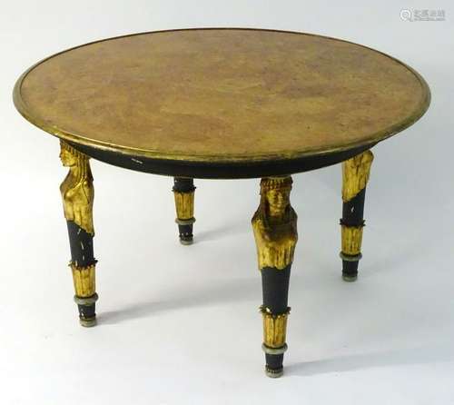 A 19thC Egyptian revival table with a burr walnut top