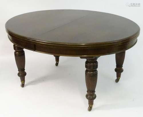 A late 19thC / early 20thC walnut 'Shoolbred' dining