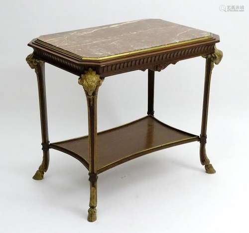 A 19thC marble top table with gilt brass surround,