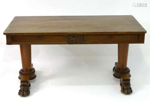 A mid 19thC mahogany library table / desk, the