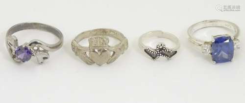 4 assorted silver / white metal rings