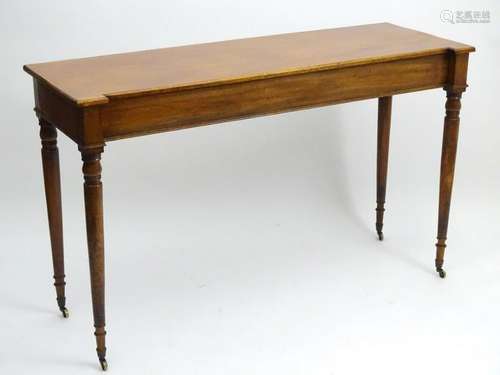 A mid 19thC mahogany serving table with an inverted