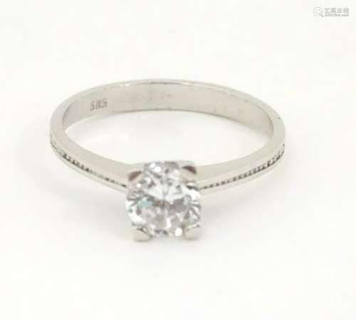 A 14kt white gold ring set with white stone