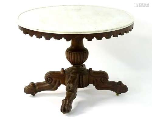 A mid 19thC mahogany marble topped oval table with a