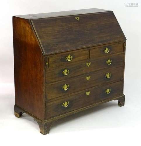 A late 18thC mahogany bureau, the fall front opening to