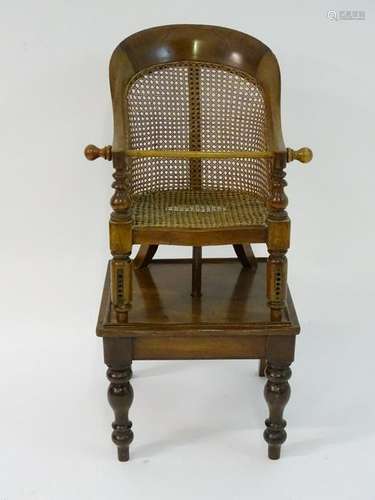 A Victorian mahogany child's chair with a curved