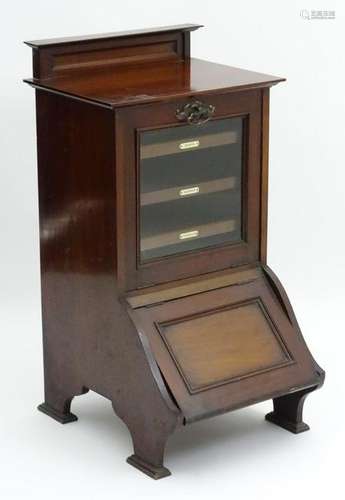 An early 20thC mahogany music cabinet purdonium, having